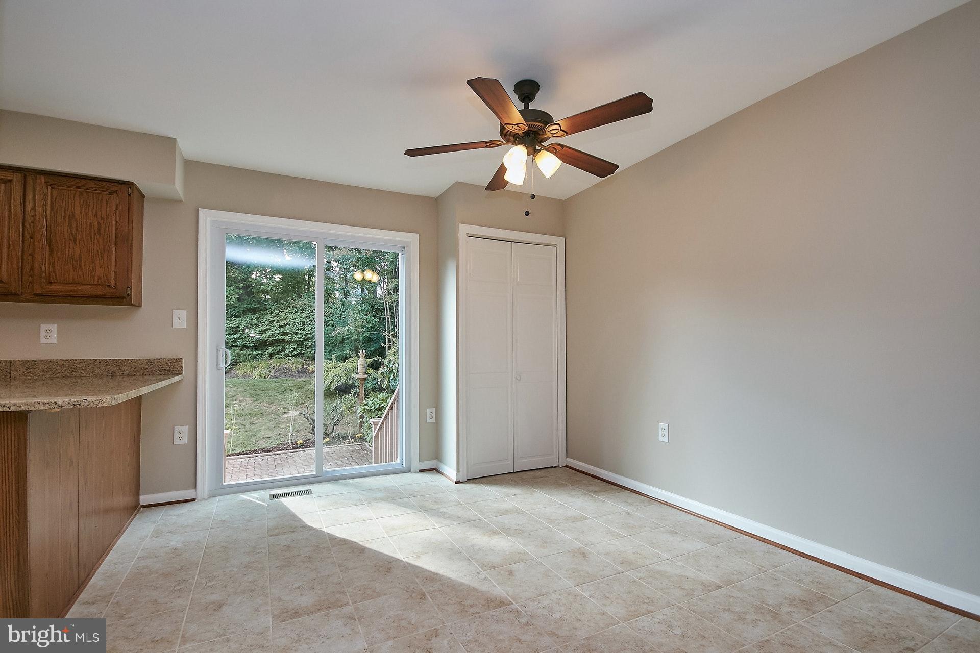 11982 Sentinel Point Court Reston, VA 20191 - Photo 9 of 28 Breakfast Room w/New Sliding Glass Door to Patio