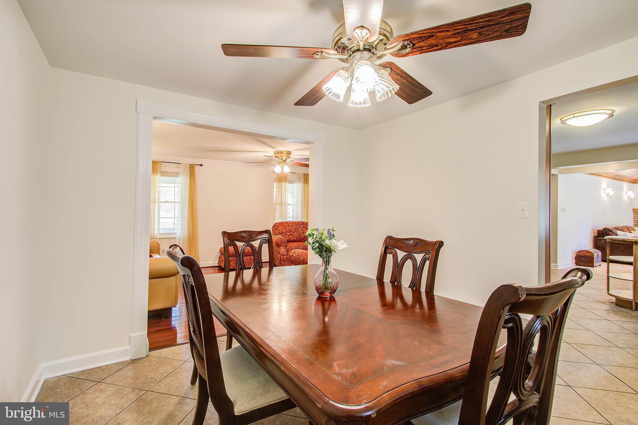 1413 Rainbow Drive Silver Spring, MD 20905 - Photo 11 of 50 a view of a dining room with furniture