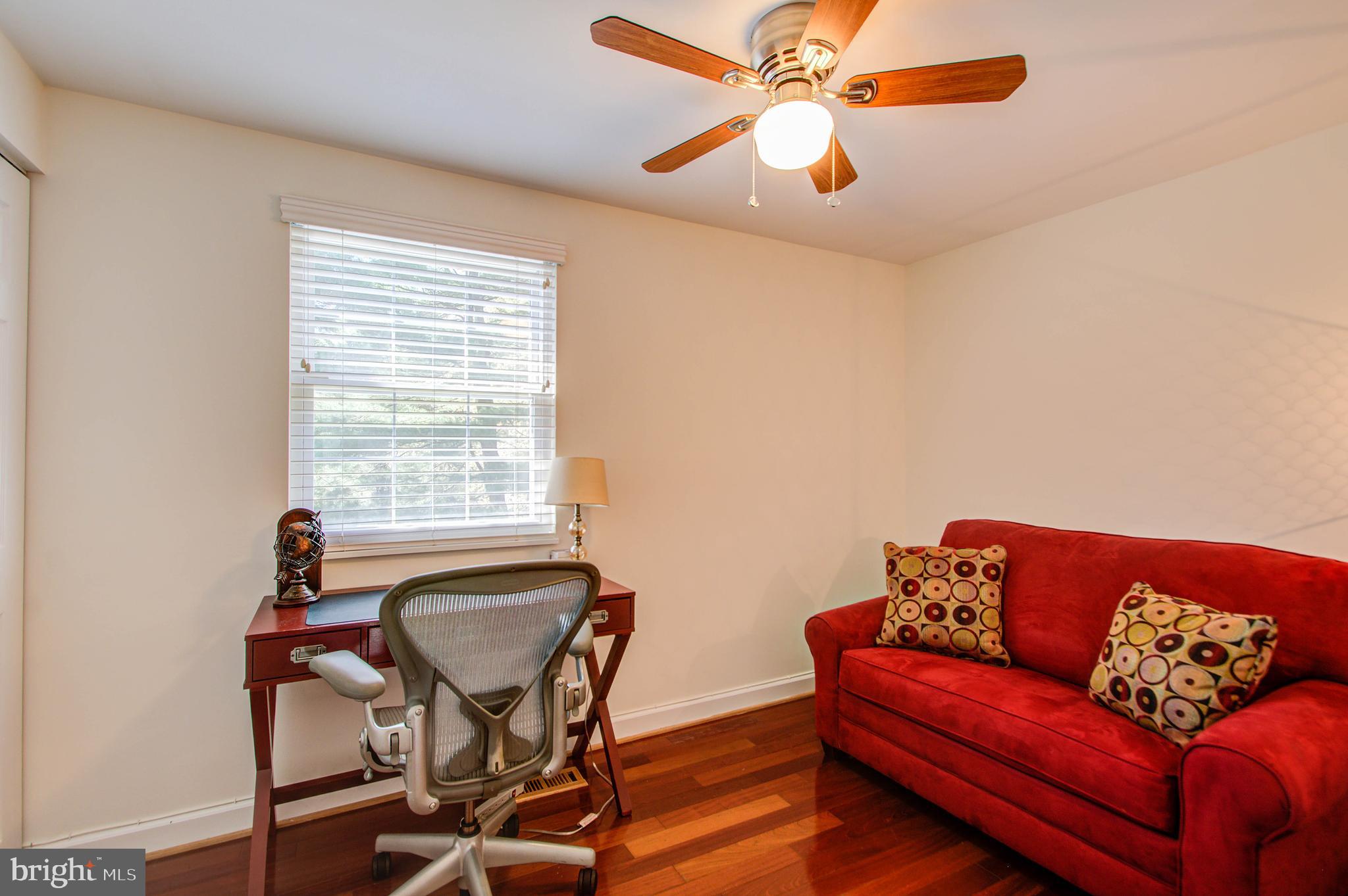 1413 Rainbow Drive Silver Spring, MD 20905 - Photo 31 of 50 a living room with furniture and a window