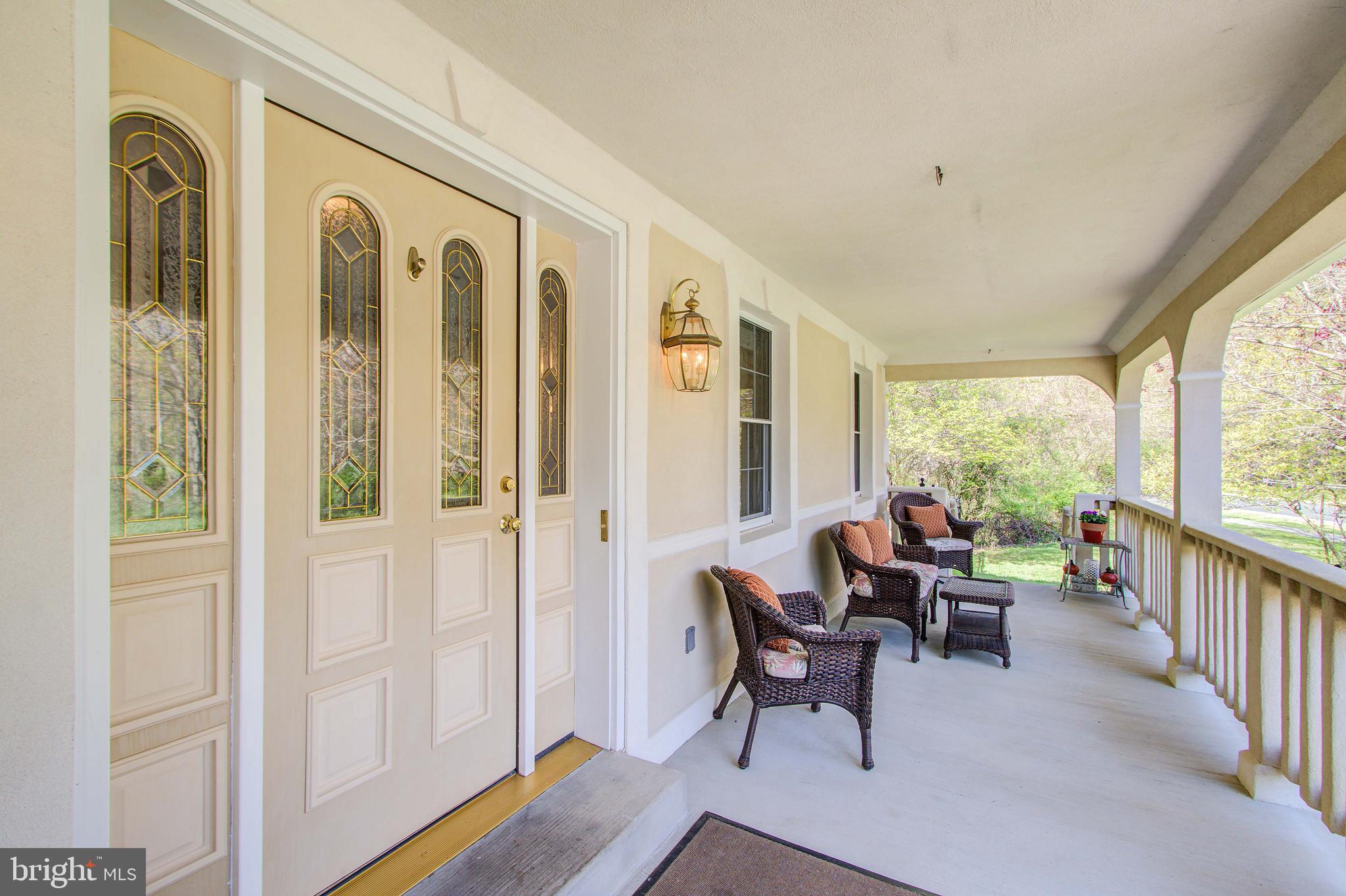 1413 Rainbow Drive Silver Spring, MD 20905 - Photo 5 of 50 a view of a hallway with wooden floor and windows