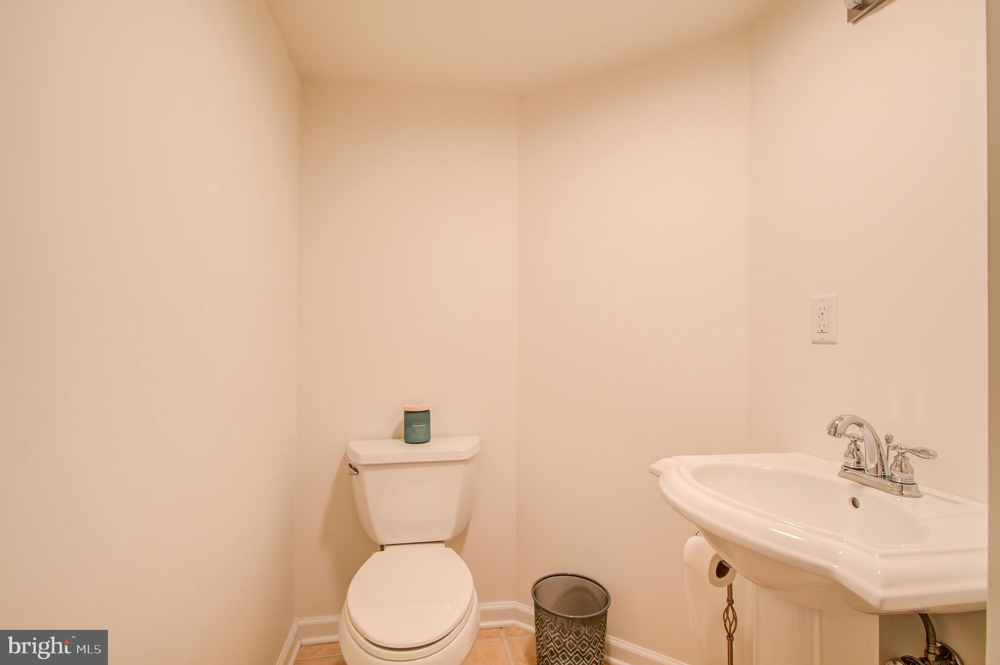 1413 Rainbow Drive Silver Spring, MD 20905 - Photo 41 of 50 a white toilet sitting next to a white sink