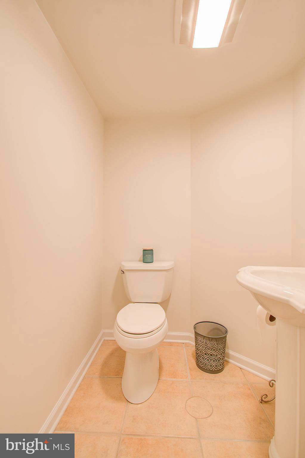 1413 Rainbow Drive Silver Spring, MD 20905 - Photo 42 of 50 a bathroom with a toilet and a vanity
