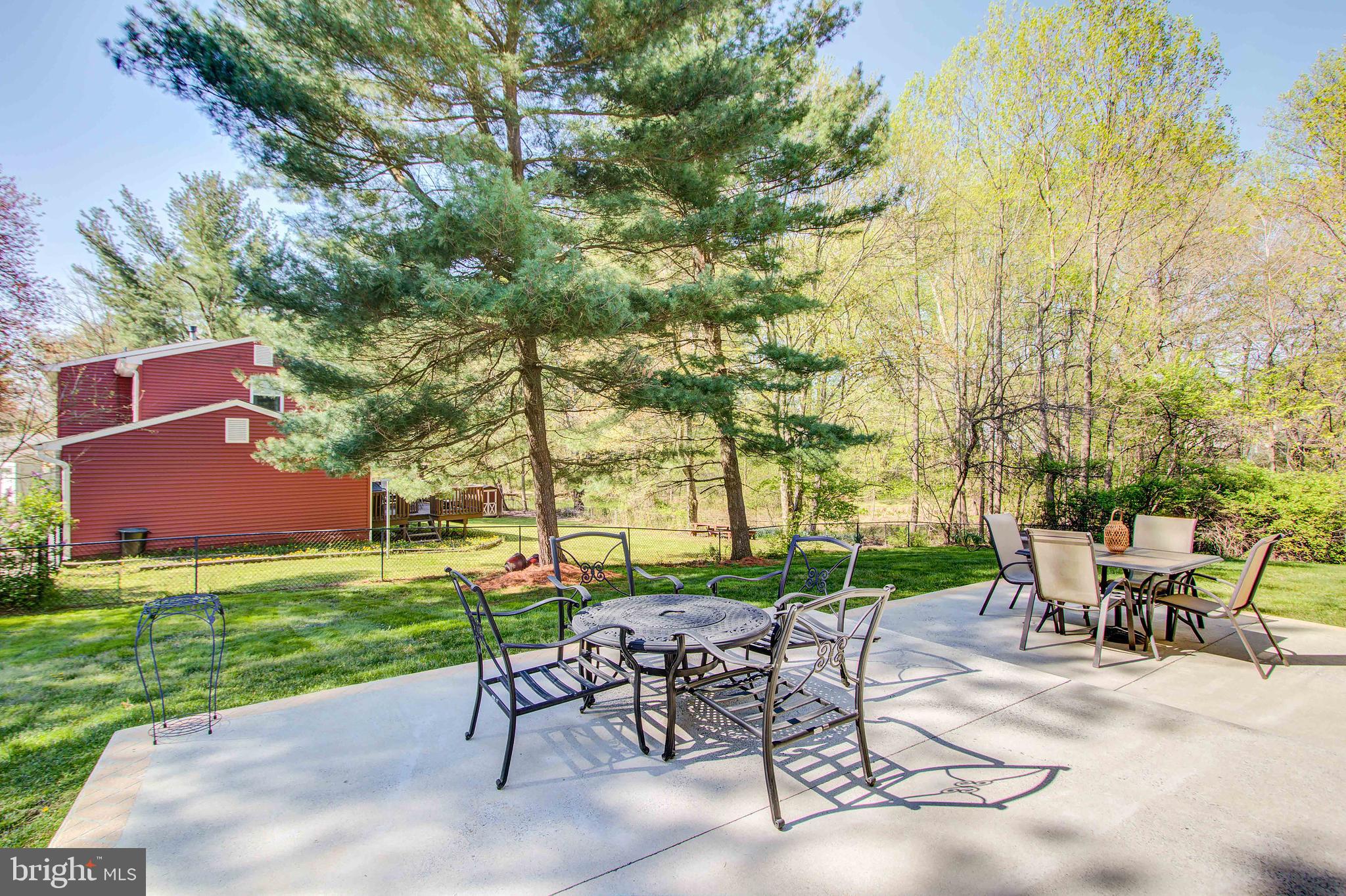 1413 Rainbow Drive Silver Spring, MD 20905 - Photo 43 of 50 a view of a chairs and table in the garden
