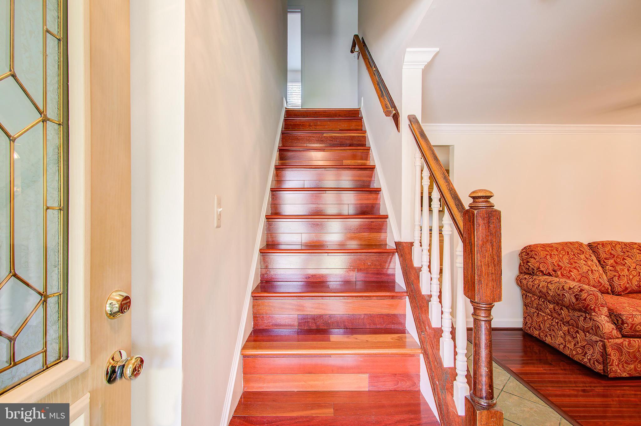 1413 Rainbow Drive Silver Spring, MD 20905 - Photo 6 of 50 a view of staircase with wooden floor and stairs