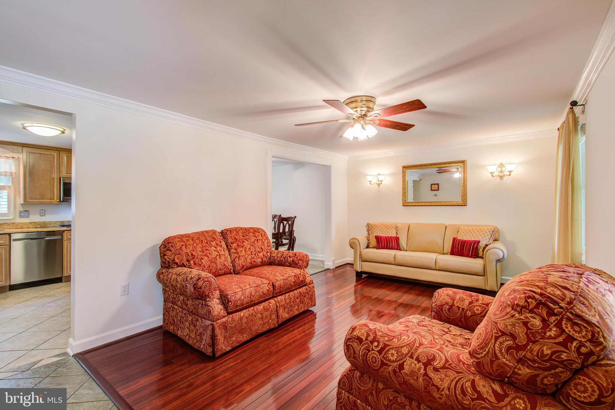 1413 Rainbow Drive Silver Spring, MD 20905 - Photo 8 of 50 a living room with furniture and wooden floor