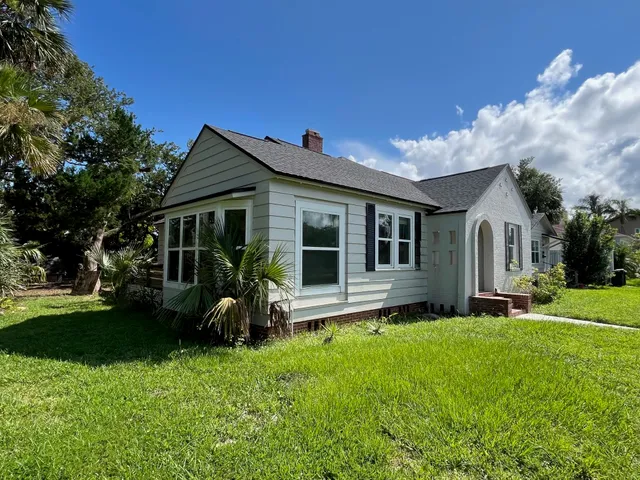 a front view of house with yard and green space