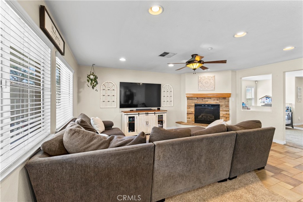 7219 Birch Tree Place Fontana, CA 92336 - Photo 14 of 49 a living room with furniture and a flat screen tv