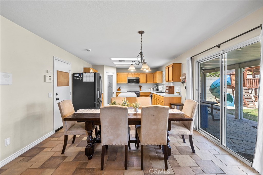 7219 Birch Tree Place Fontana, CA 92336 - Photo 15 of 49 a view of a dining room with furniture window and outside view