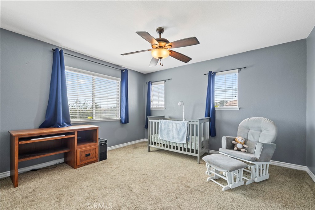 7219 Birch Tree Place Fontana, CA 92336 - Photo 29 of 49 a bedroom with furniture and a window