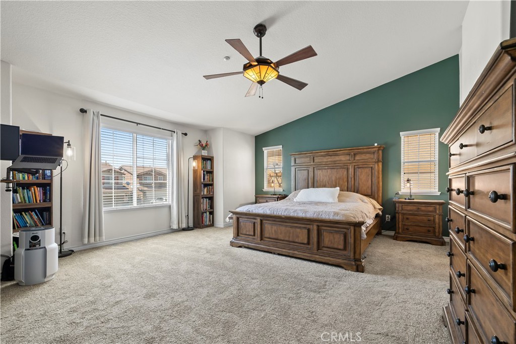 7219 Birch Tree Place Fontana, CA 92336 - Photo 32 of 49 a living room with a bed furniture and a flat tv screen