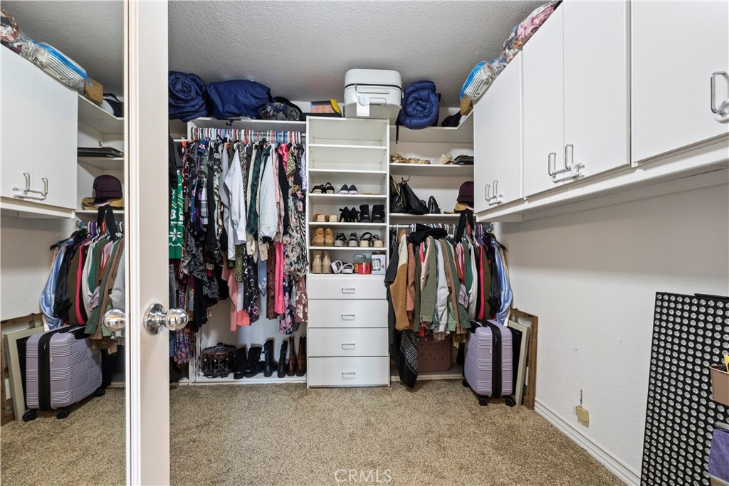 7219 Birch Tree Place Fontana, CA 92336 - Photo 40 of 49 a view of walk in closet with clothes