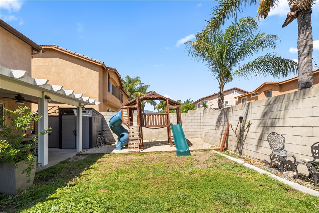 7219 Birch Tree Place Fontana, CA 92336 - Photo 43 of 49 a view of a backyard with a iron fence