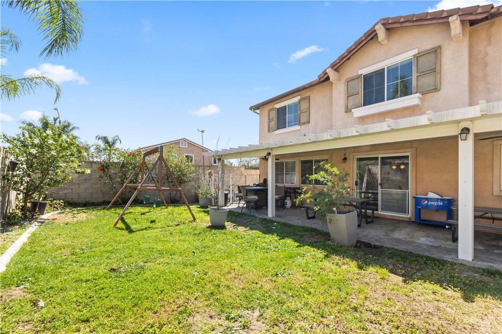 7219 Birch Tree Place Fontana, CA 92336 - Photo 45 of 49 a backyard of a house with yard and outdoor seating