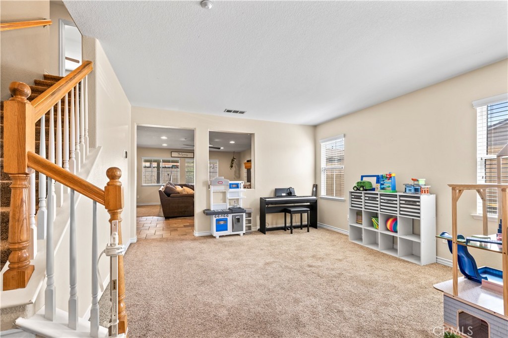 7219 Birch Tree Place Fontana, CA 92336 - Photo 5 of 49 a view of a livingroom with furniture and staircase