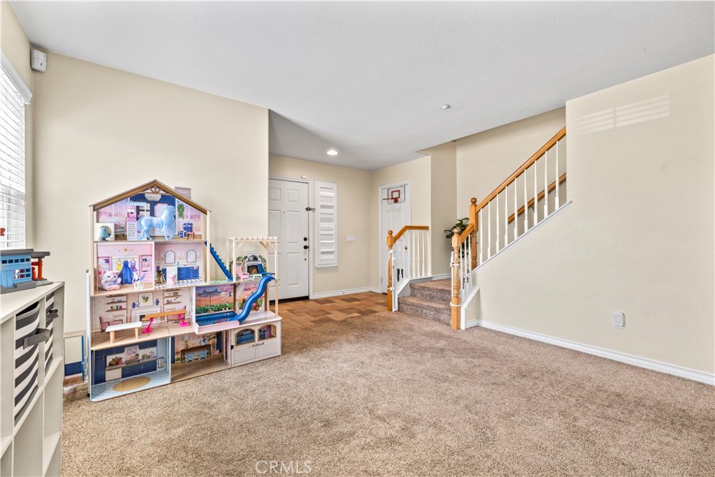 7219 Birch Tree Place Fontana, CA 92336 - Photo 7 of 49 a view of a livingroom with furniture and staircase
