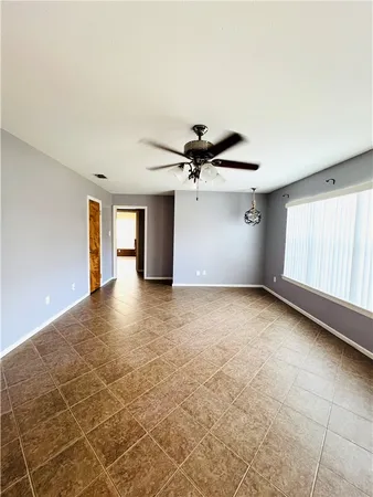 a view of livingroom with hardwood floor and ceiling fan