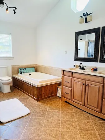 a bathroom with a shower curtain and a sink