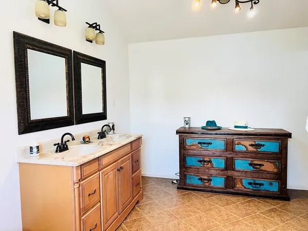 a bedroom with a bed and a table