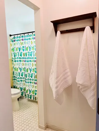 a view of a small space with wooden fence