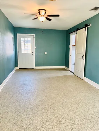 a view of a backyard with wooden fence