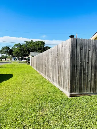 a view of a porch with a table and chairs