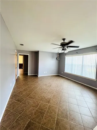 a room with a bed and window