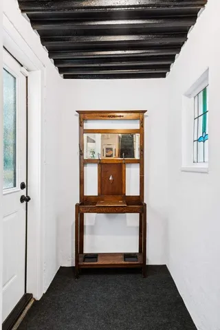 a view of backyard with swimming pool and outdoor seating