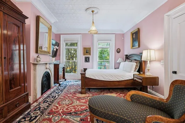 a bathroom with a granite countertop sink mirror vanity and toilet