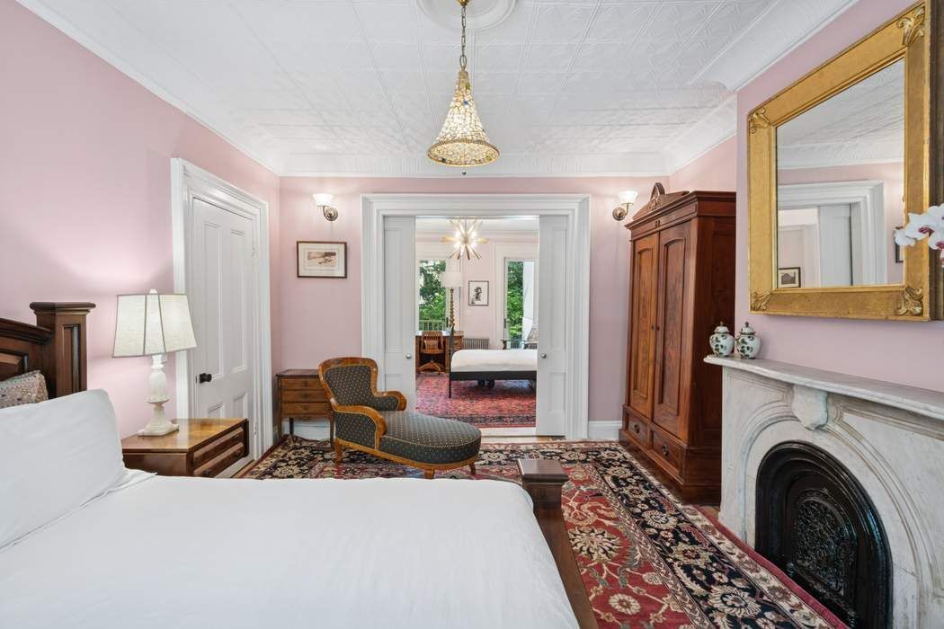 361 Dean Street Brooklyn, NY 11217 - Photo 15 of 18 a living room with furniture a fireplace and a chandelier