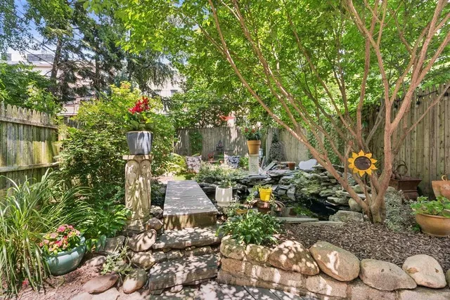 a kitchen with refrigerator cabinets and wooden floor