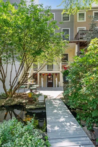 a garden view with a seating space