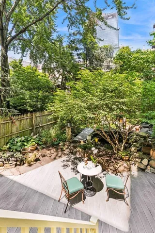 a front view of a house with a yard garage and outdoor seating