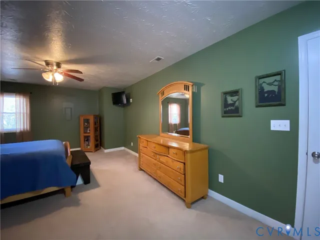 a bed room with a bed and a chandelier