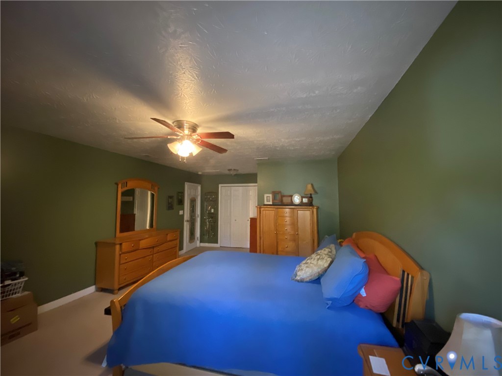 3766 Venter Road Richmond, VA 23227 - Photo 16 of 50 a bedroom with furniture and wooden floor