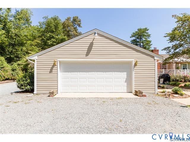 3766 Venter Road Richmond, VA 23227 - Photo 22 of 50 a view of a house with a yard and garage