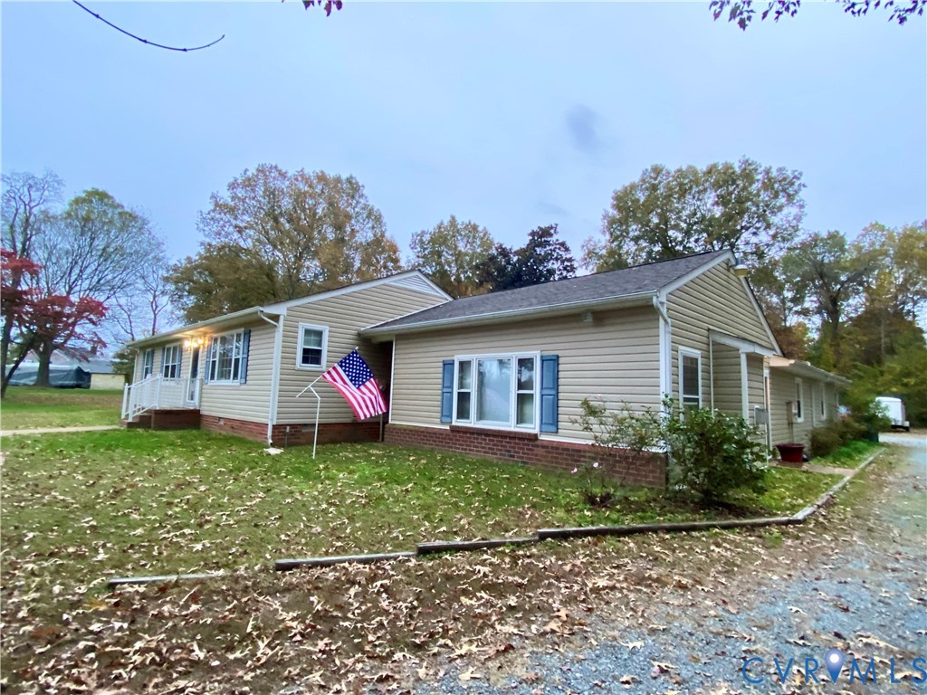 3766 Venter Road Richmond, VA 23227 - Photo 23 of 50 a view of a house with a yard and potted plants