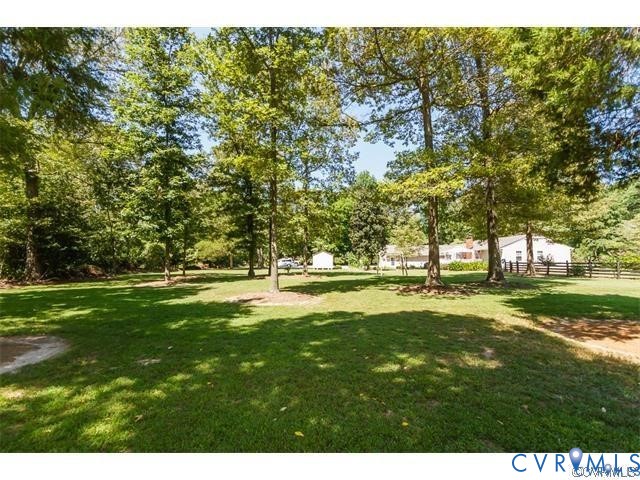3766 Venter Road Richmond, VA 23227 - Photo 25 of 50 a view of yard with swimming pool and trees