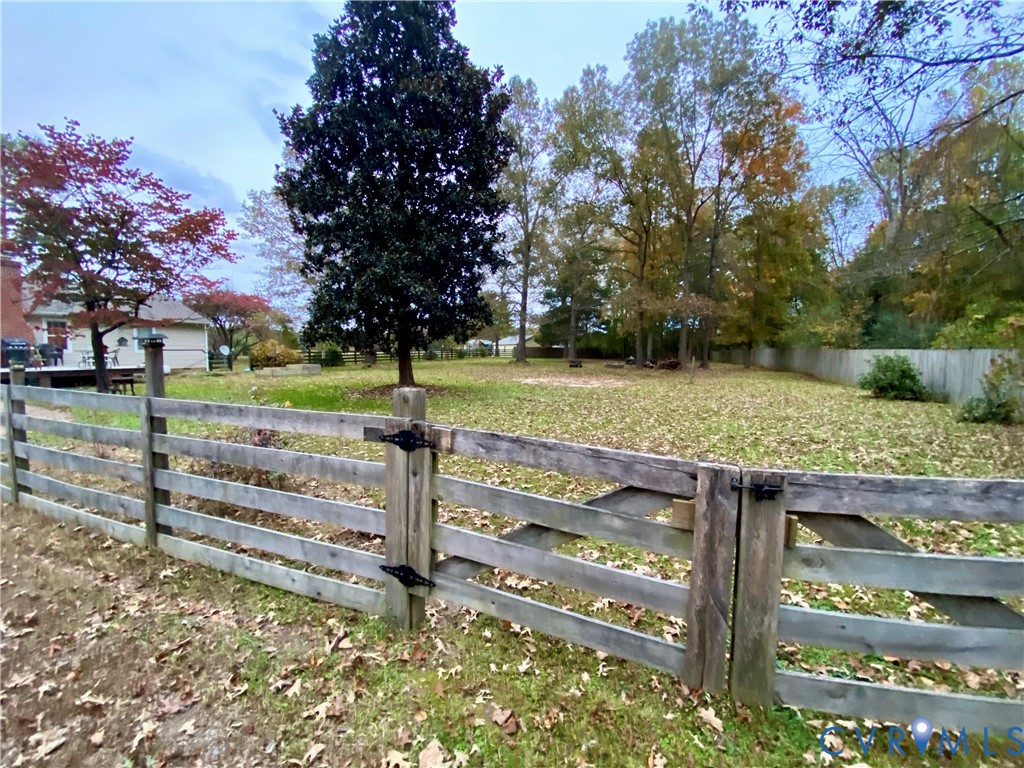 3766 Venter Road Richmond, VA 23227 - Photo 30 of 50 a view of a wooden fence and trees in the background
