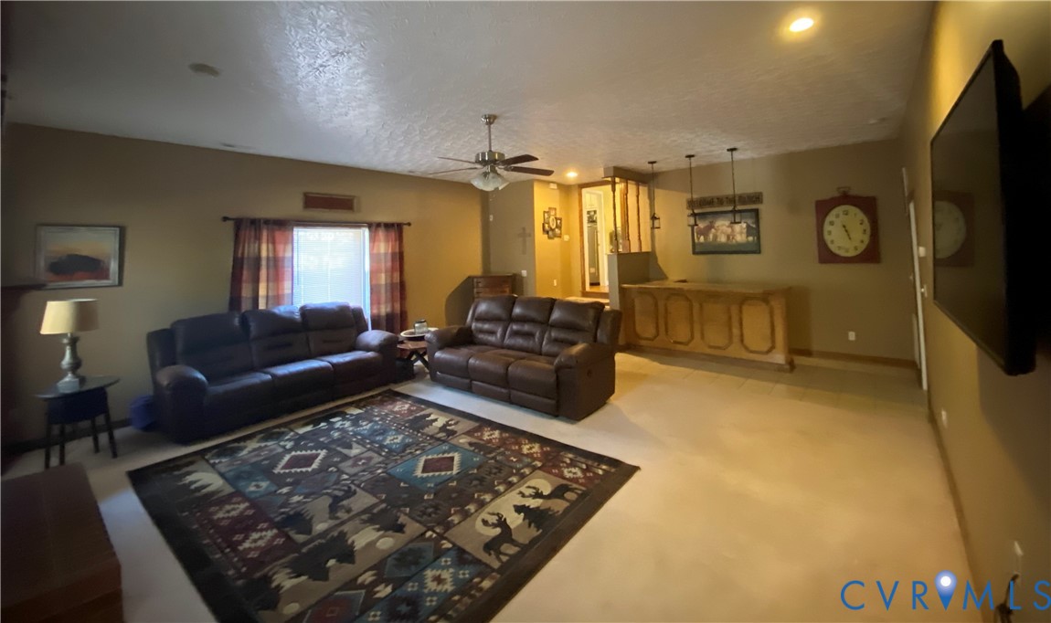 3766 Venter Road Richmond, VA 23227 - Photo 48 of 50 a living room with a couch and a flat screen tv