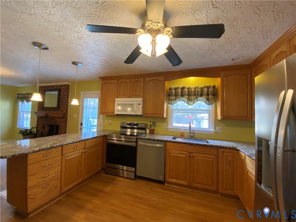 3766 Venter Road Richmond, VA 23227 - Photo 10 of 50 a kitchen with stainless steel appliances granite countertop a sink a stove and refrigerator