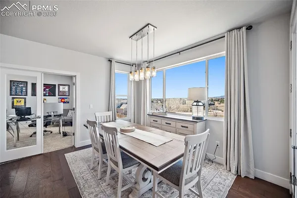 a workspace with furniture and a window