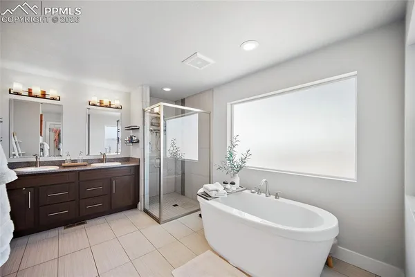 a view of a bathroom with a tub and shower
