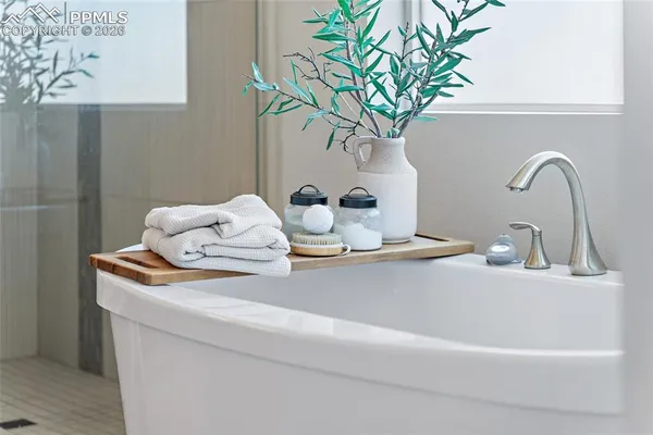 a bedroom with a bed dresser and a window