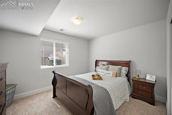 a view of a balcony with chairs and wooden floor