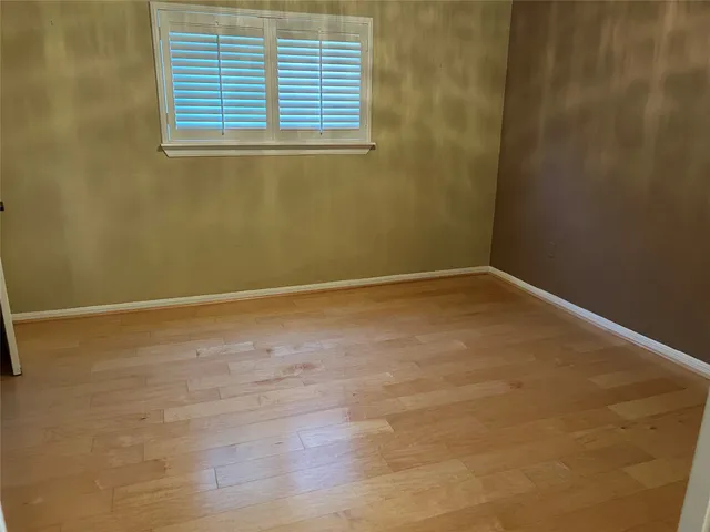 a view of a house with a swimming pool and a yard