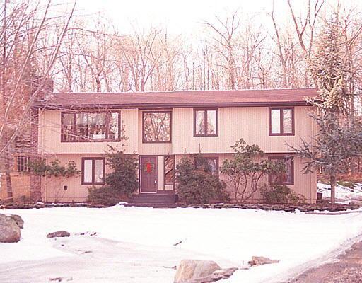 45 Hulda Hill Road Wilton, CT 06897 - Photo 1 of 1 a front view of a house