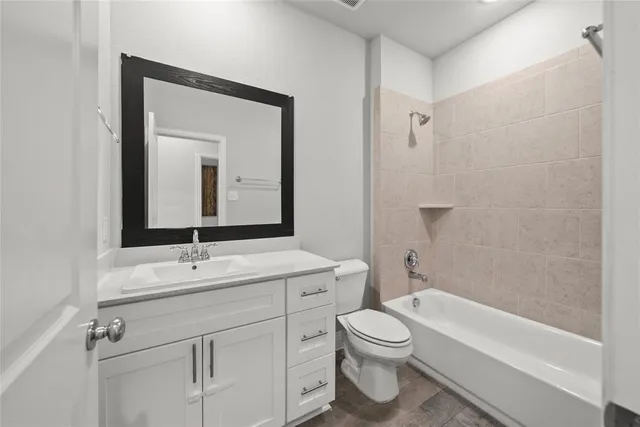 a bathroom with a toilet a sink and a bathtub