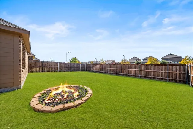 a view of a play ground in front of a house