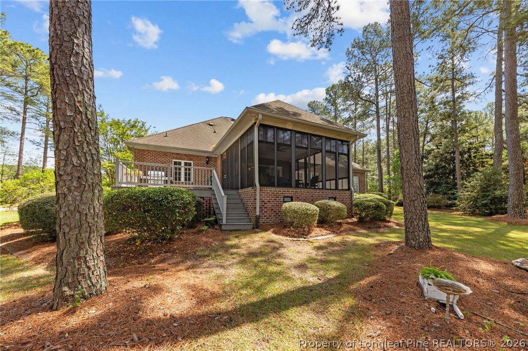 30180 East Lake Road Wagram, NC 28396 - Photo 7 of 42 a view of a house with backyard and sitting area