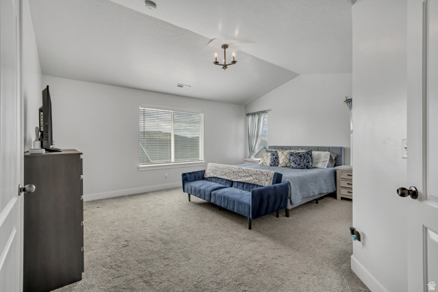 1577 Quailhill Road Saratoga Springs, UT 84045 - Photo 18 of 46 Primary bedroom featuring vaulted ceiling and light carpet